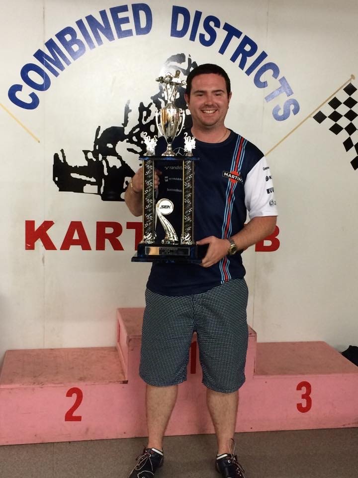 Matt on the podium with a karting trophy